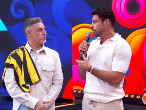 Luciano Huck interrompe Cauã Reymond e público especula suposto motivo