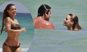 Carol Dieckmann exibe corpão em dia de praia com Bruno de Lucca