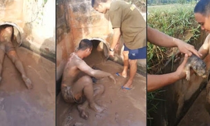 Homem salva filhotes dentro de uma tubulação de esgoto
