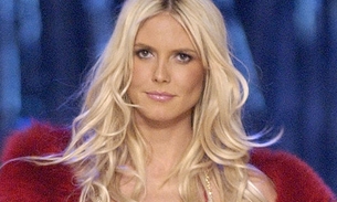 Heidi Klum faz topless durante férias no Caribe