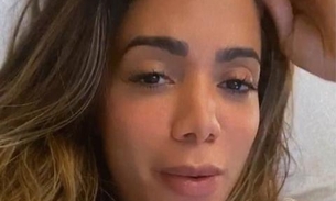 Internada, Anitta rebate desaforo de seguidora e dá no olho