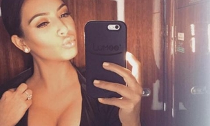 Kim Kardashian aparece ‘estranha' em foto com irmã e fãs questionam