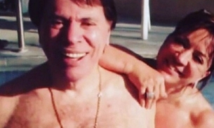 Silvio Santos surpreende ao aparecer sem camisa em piscina com a mulher