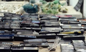 Detentos que usam celular na cadeia podem ter aumento de pena