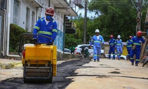 Ruas de bairros afetados com obras do Prosamim III começam a receber asfalto