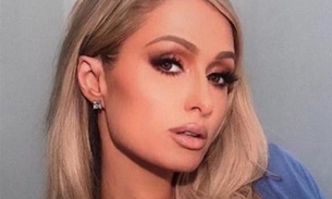 Fantasiada de coelhinha, Paris Hilton faz supresa e sai de bolo gigante 