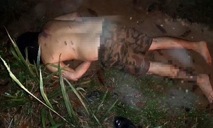 Com camisa enrolada na cabeça e marcas de tortura, corpo de homem é achado em ramal de Manaus