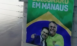 Banner não autorizado com imagem de Bolsonaro e Alberto Neto é retirado de ponte em Manaus